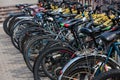 Tula, Russia - August 2, 2021: Row of many bicycle at public outdoor bicycle parking under summer daylight.