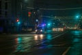 Tula, Russia - December 31, 2020: Ambulance car moving toward camera on empty night street in city