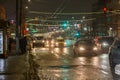 Tula, Russia - December 20, 2020: Night automobile traffic on wide city street - close-up telephoto shot