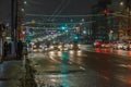 Tula, Russia - December 20, 2020: Night automobile traffic on wide city street - close-up telephoto shot