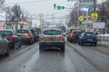 Tula, Russia - February 21, 2021: Cars stopped on crossroads traffic lights at winter day on main street.