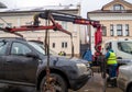 Tow truck manipulator picks up an incorrectly parked car