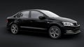 Tula, Russia. July 10, 2021: Volkswagen Polo sedan black compact city car isolated on black background. 3d rendering.