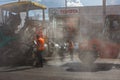 Tula, Russia - May 16, 2021: Process of asphalting, asphalt paver machine and road roller during road construction works