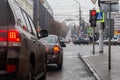 TULA, RUSSIA - NOVEMBER 21, 2020: Winter daytime street cars and pedestrians traffic at cross roads