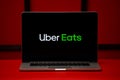 Tula 06.02.2020 Ubereats logo on the laptop screen isolated on the red background.