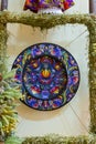 Tulchyn, Ukraine - 06.10.2020: clay plate, traditional Ukrainian Petrykivka painting style, flower, bird and ornament