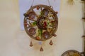 Tulchyn, Ukraine - 06.10.2020: traditional amulet, Ukrainian Podillia ornament painting style, clay plate on a wooden wagon wheel Royalty Free Stock Photo