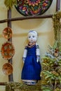 Tulchyn, Ukraine - 06.10.2020: traditional Ukrainian rag doll, Podillia ornament painting style, clay plate, wooden frame, ethno