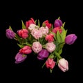 Vibrant tulip bouquet top view macro on black background Royalty Free Stock Photo