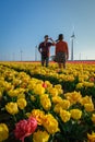 Tulip fields in the Netherlands, couple men and woman in flower field during Spring in the Nethertlands Royalty Free Stock Photo