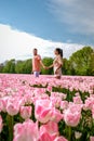 Tulip fields in the Netherlands, couple men and woman in flower field during Spring in the Nethertlands Royalty Free Stock Photo
