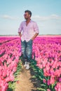 Tulip fields in the Netherlands, men in flower field during Spring in the Nethertlands Royalty Free Stock Photo