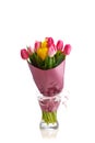 Tulip flowers bouquet in a glass vase, isolated on white Royalty Free Stock Photo