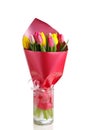 Tulip flowers bouquet in a glass vase, isolated on white Royalty Free Stock Photo