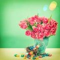 Tulip flowers and chocolate easter eggs. Vintage style toned pic Royalty Free Stock Photo
