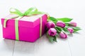 Tulip Flowers and Giftbox on rustic table for March 8, International Womens Day, Birthday , Valentines Day or Mothers day Royalty Free Stock Photo