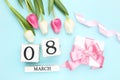 Tulip flowers, ribbon, wooden cube calendar