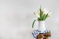 Tulips bouquet in white vase on wooden rustic chair Royalty Free Stock Photo