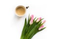 Fresh bouquet of five tulips isolated on white background with a cup of coffee. Spring flowers. Royalty Free Stock Photo