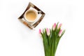 Fresh bouquet of spring tulips isolated on white background with a cup of coffee Royalty Free Stock Photo