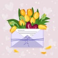 Tulips in a craft envelope with a love note and hearts Royalty Free Stock Photo