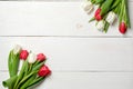 Tulips flowers on white wooden background. Top view, frame, border, corner. Greeting card for womans day, mothers day, birthday, e Royalty Free Stock Photo