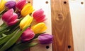 Tulips over wooden table Royalty Free Stock Photo