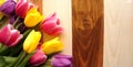 Tulips over wooden table Royalty Free Stock Photo