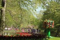 Tulips, sculpture, lake, trees, Keukenhof Gardens