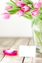 Tulips in vase and candle Royalty Free Stock Photo