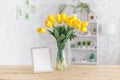 Tulips in a vase on a wooden table. Scandinavian interior. Mockup Royalty Free Stock Photo