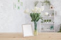 Tulips in a vase on a wooden table. Scandinavian interior. Mockup Royalty Free Stock Photo