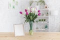 Tulips in a vase on a wooden table. Scandinavian interior. Mockup Royalty Free Stock Photo