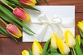 Tulips and white paper card Royalty Free Stock Photo