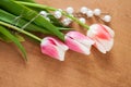 Tulips and white pearls lie on the table