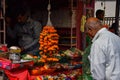 Picture of people purchasing worship items from vendor