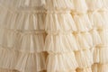 Tulle beige luxury dress with ruffles. Royalty Free Stock Photo