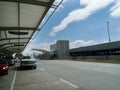 Tulsa International Airport exterior daytime, vehicles in drop off lane Royalty Free Stock Photo