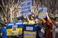 Support Ukraine Rally with many signs in blue and yellow - Putins Face with Killer - Save Ukraine - No Fly