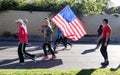 Unner with American Flag in Tulsa Run down Peoria Avenue in- close-up