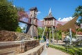 The Gathering Place - Award winning public park in Oklahoma - teenage boy walks past climbing castles and
