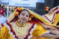 Tulsa USA Beautiful Hispancing girls smiles as she dances in a swirl of yellow desses at a street festival - movement