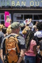 05-30-2020 Tulsa USA - Man in cap with orange backpack and Covid-mask stands at back of crowd of protestors with Urban Outfitters