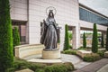 Tulsa USA - Mary Queen of Heaven Statue on round pedestal in front of St. Francis Hospital in seating area near