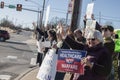 USA Peaceful anti-war protestors with smiles and signs waving at passersby on street corner