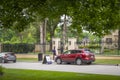 06-01-2019 Tulsa USA Valet parking on neighborhood street outside luxious fenced estate with many tall trees