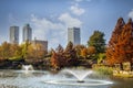 Tulsa USA - View from Central Park of downtown Tulsa Oklahoma on bright autumn day with colorful foliage and lake and