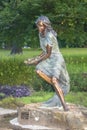 Tulsa USA - Poems and Promises sculpture of a woman reading Shakespeare in the middle of an ornamental herb garden in