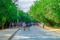 TULUM, MEXICO - JANUARY 10, 2018: Crowd of people walking in an ecological path surrounding of nature in Mayan ruins of Royalty Free Stock Photo